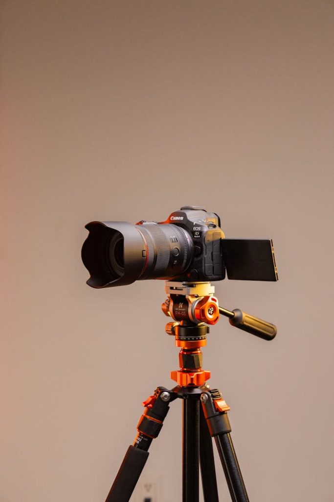 High-quality camera mounted on a tripod in a professional studio setting.